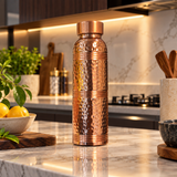 Hammered ring-neck copper bottle bright kitchen lifestyle view