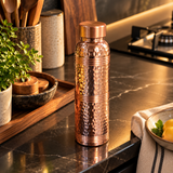 Hammered ring-neck copper bottle modern kitchen lifestyle view