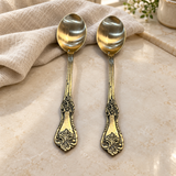 Ornate spoon set of two — close view of decorative handles