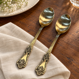 Ornate spoon set of two — wood dining table lifestyle view
