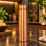 Wide cap plain copper water bottle standing on a premium kitchen counter