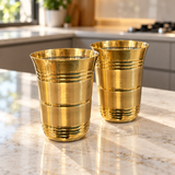 Royal ribbed brass tumbler set of two filled with water